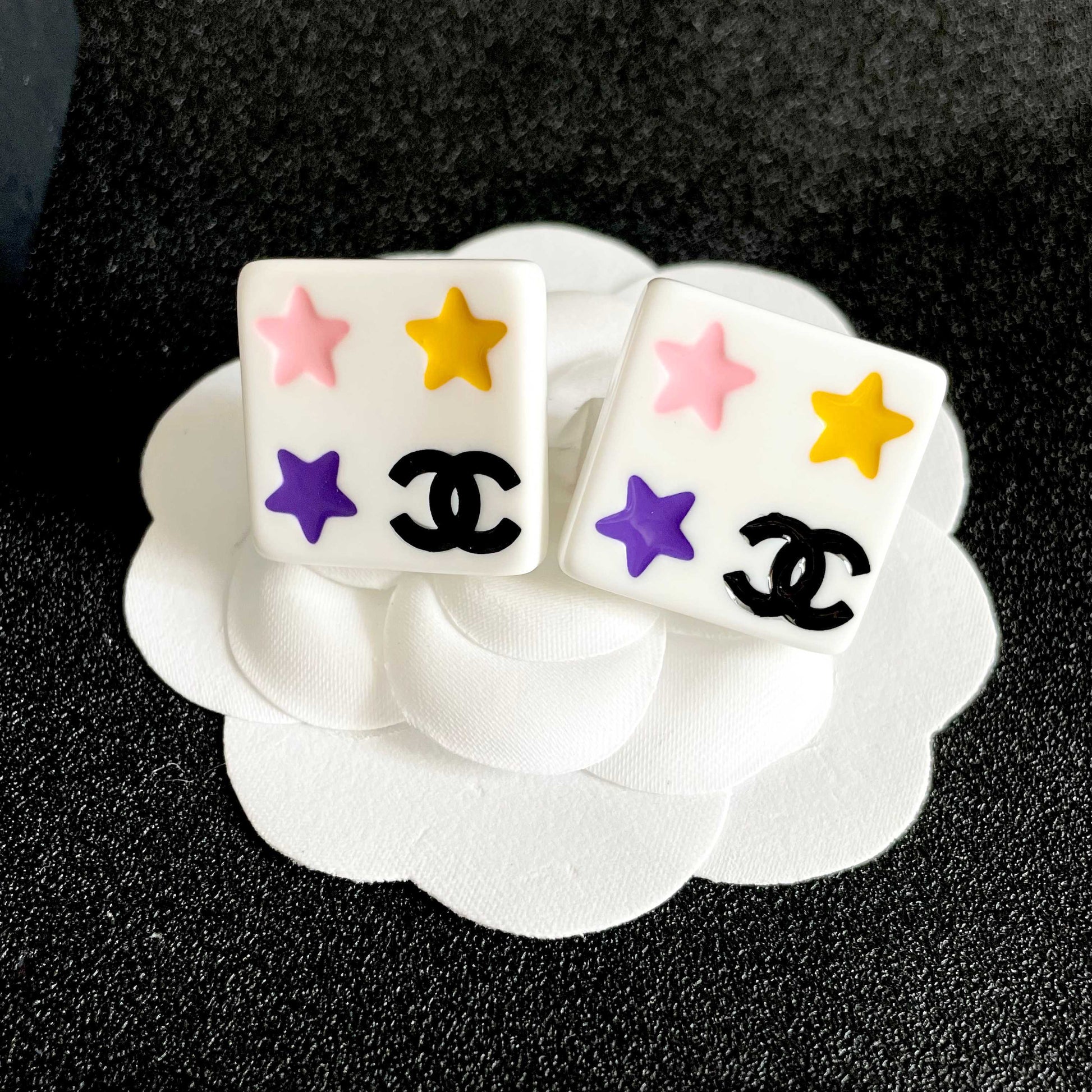 Double-C Emblem Stud Earrings in Polished Metal-Tone – Star Detail front product view