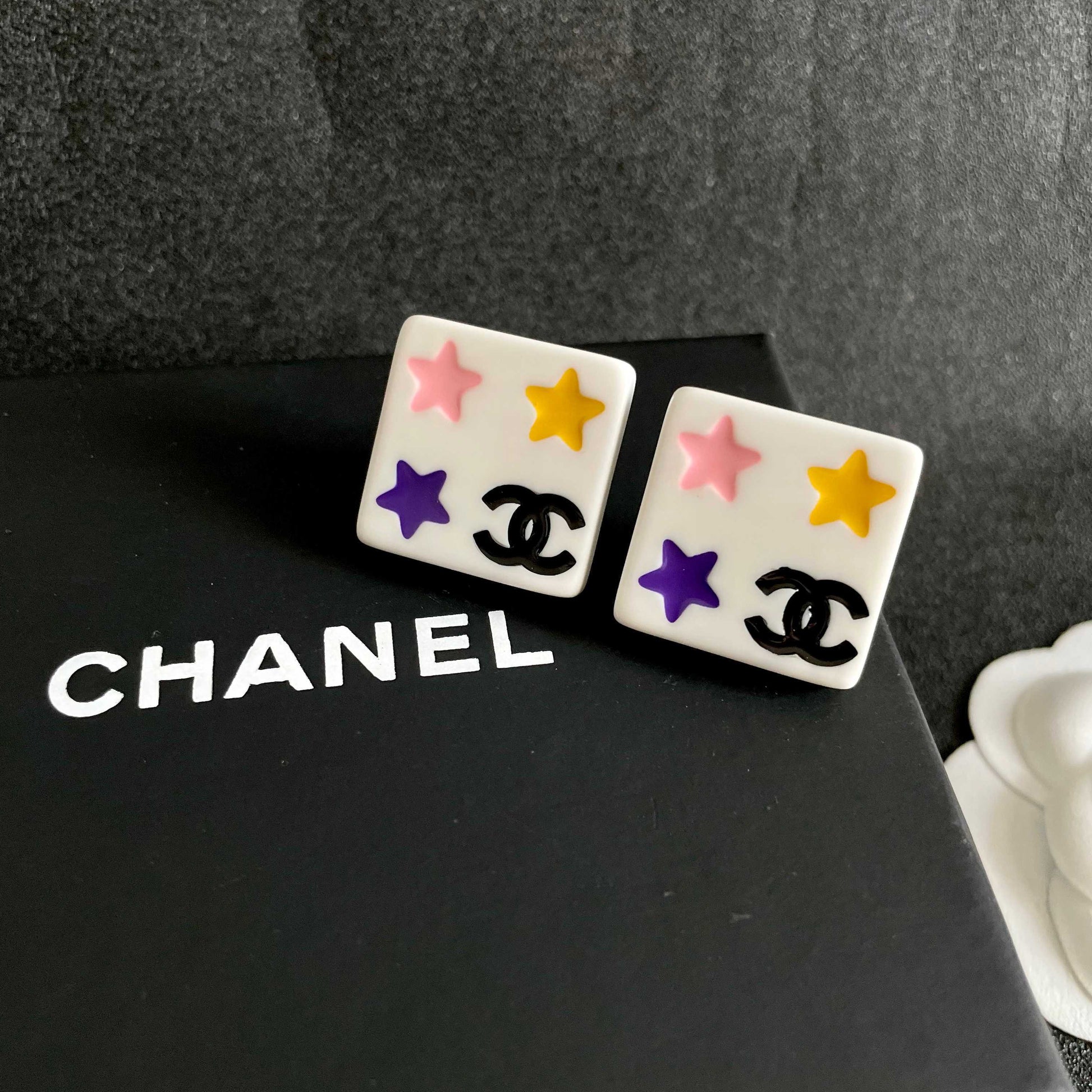 Double-C Emblem Stud Earrings in Polished Metal-Tone – Star Detail detail view