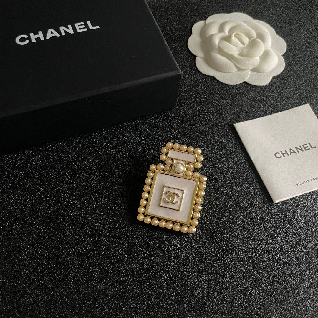 Double-C Emblem Brooch in Polished Metal-Tone – Pearl Detail styled product view