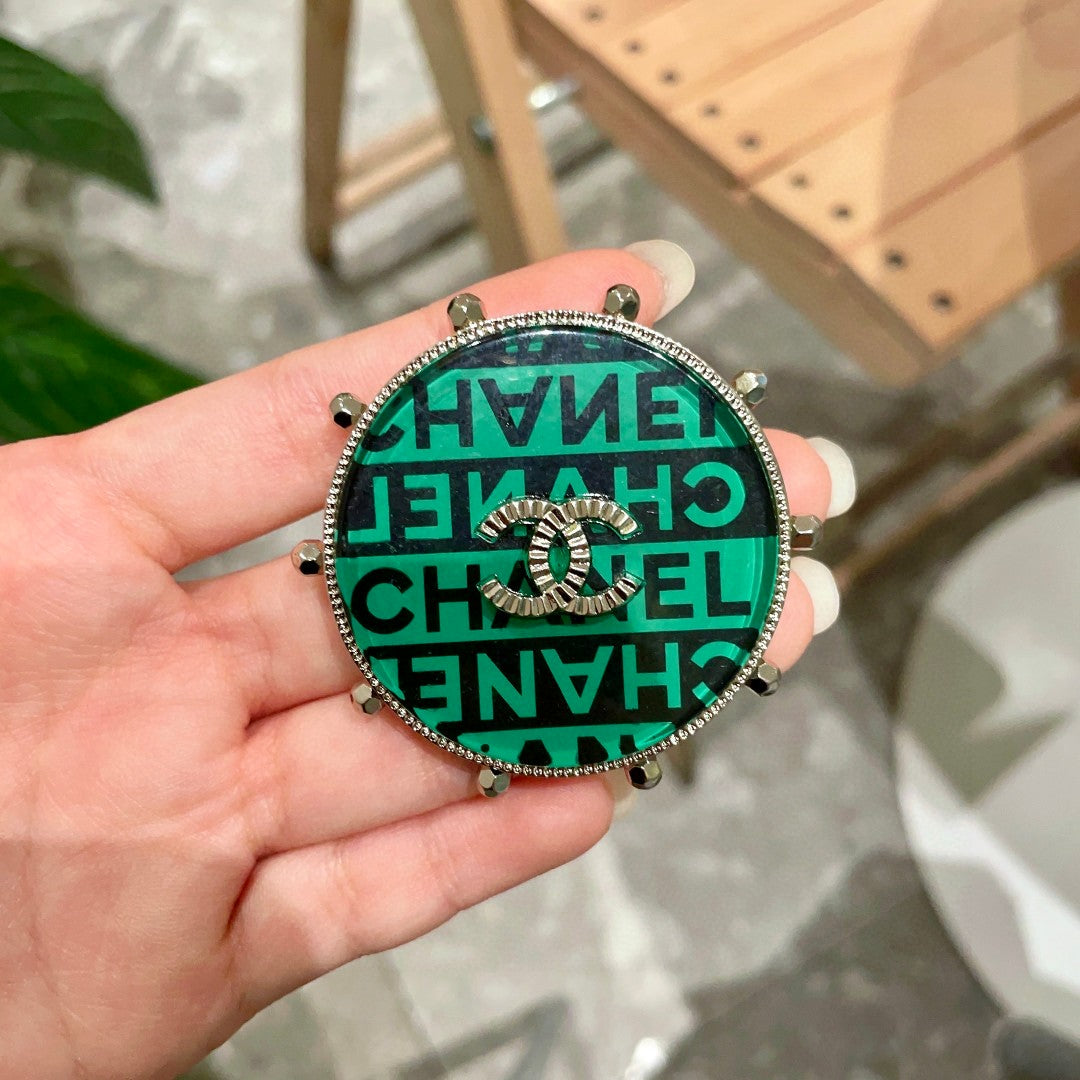 Double-C Emblem Brooch in Polished Metal-Tone – Design 009 detail view