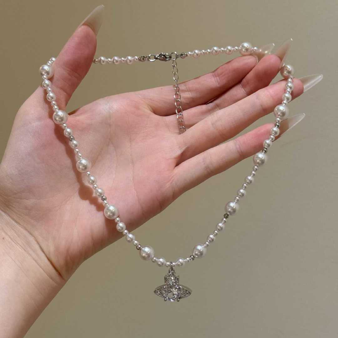 Orb Pendant Necklace in Polished Metal-Tone – Pearl Detail close-up detail