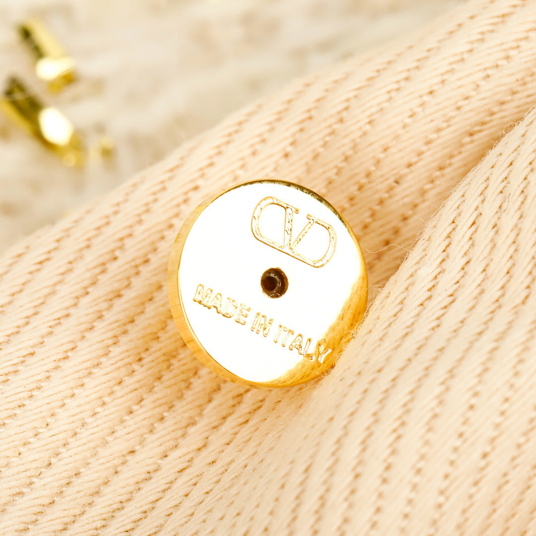 Bow Statement Earrings in Polished Metal-Tone close-up view