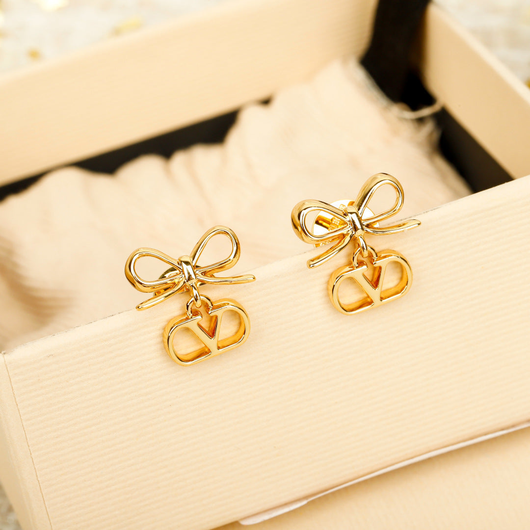 Bow Statement Earrings in Polished Metal-Tone front view
