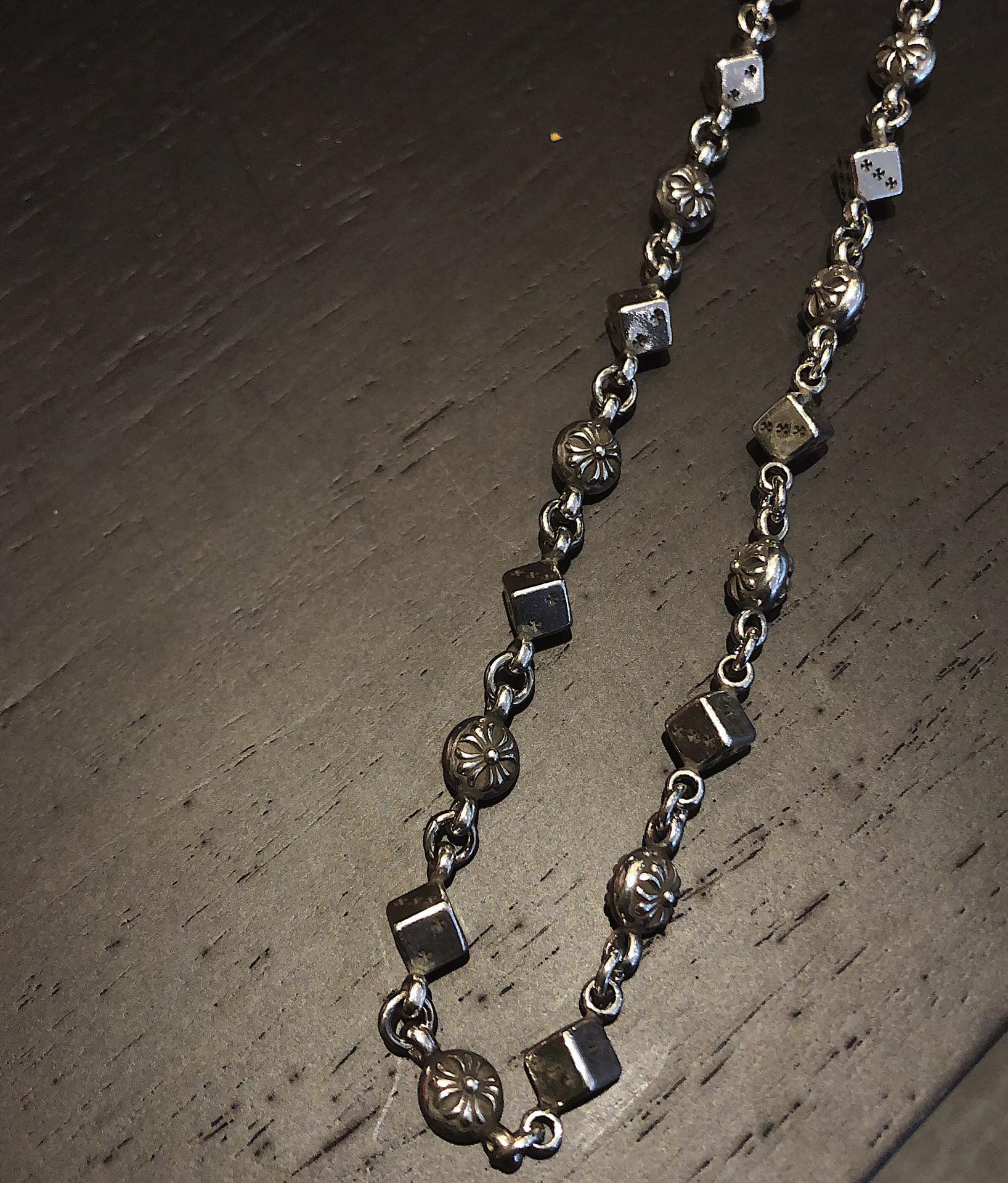 Cross Pendant Necklace in Metal-Tone – Dice Detail close-up detail