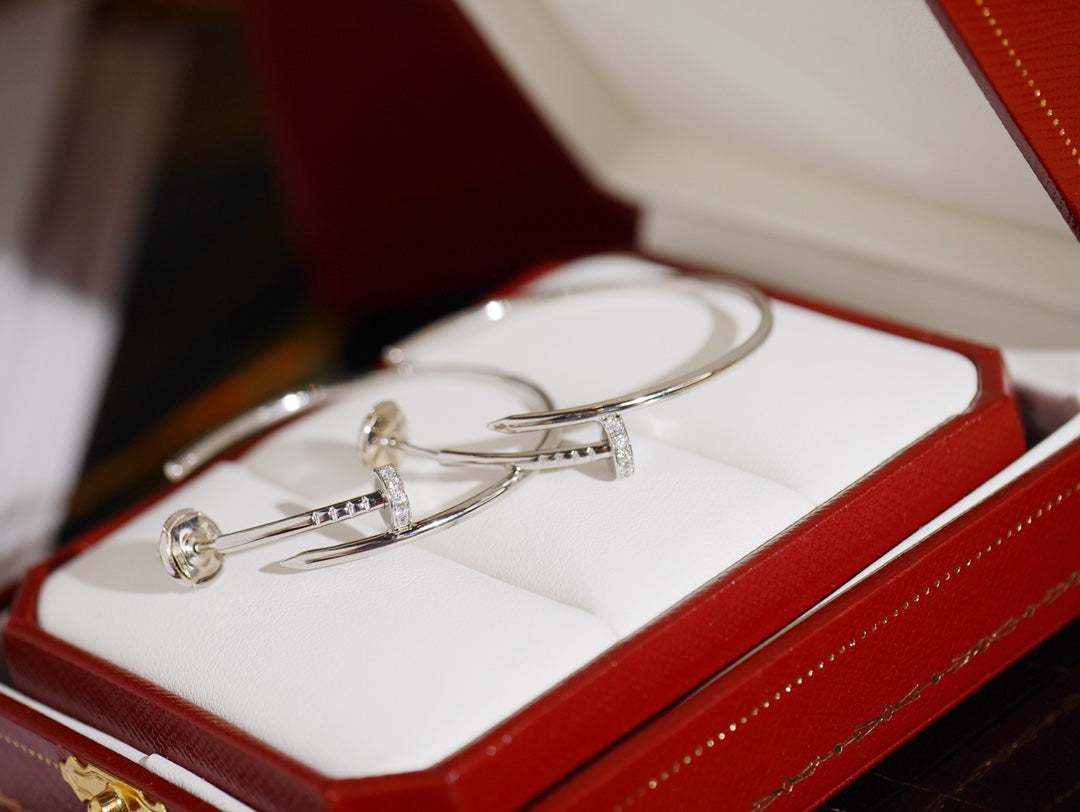 Nail Motif Earrings in Polished Metal-Tone with Crystal-Style Accents close-up detail