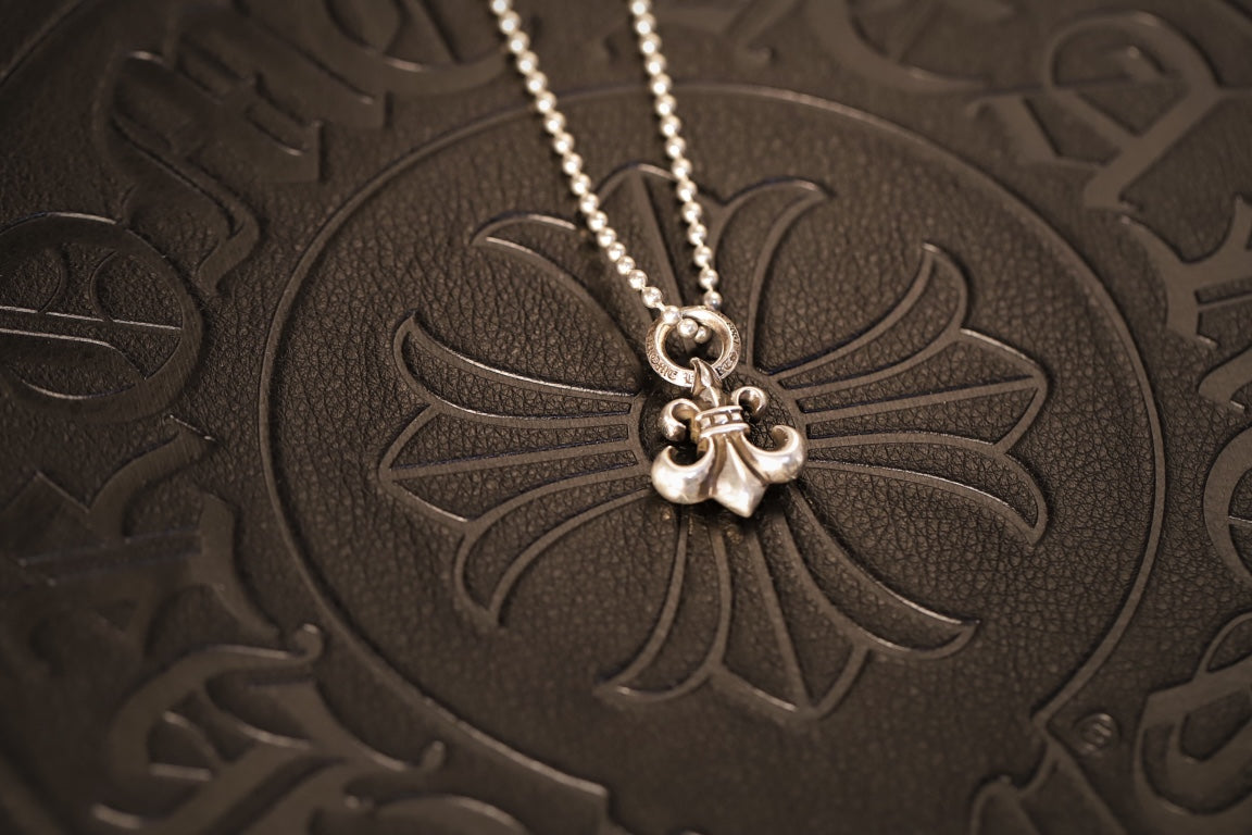 Fleur-de-Lis Pendant in Metal-Tone close-up detail