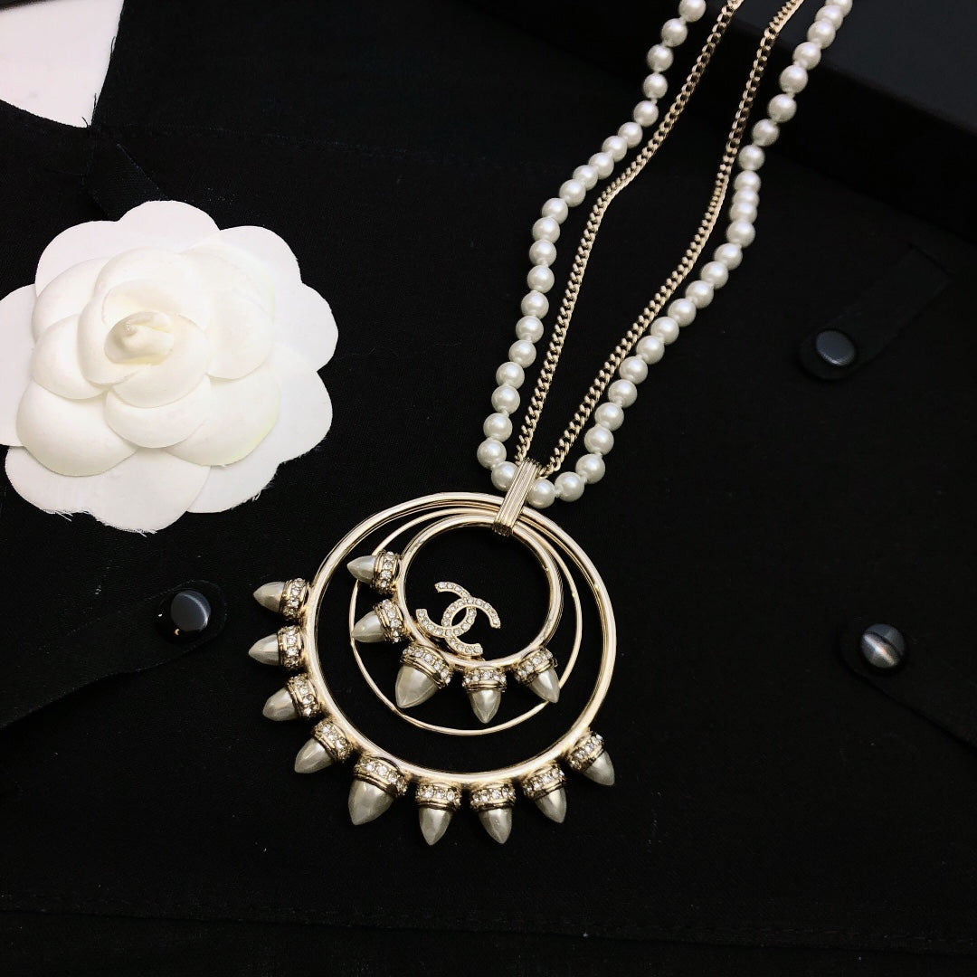 Double-C Emblem Pendant Necklace in Polished Metal-Tone – Design 004 close-up detail