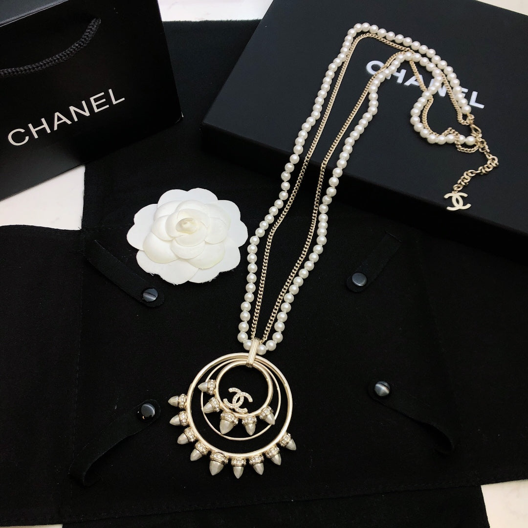 Double-C Emblem Pendant Necklace in Polished Metal-Tone – Design 004 detail view