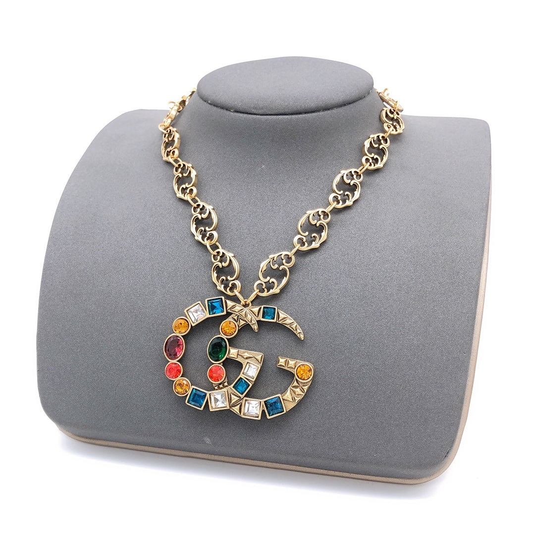 Double-G Emblem Pendant Necklace in Polished Metal-Tone – Crystal Detail styled product view
