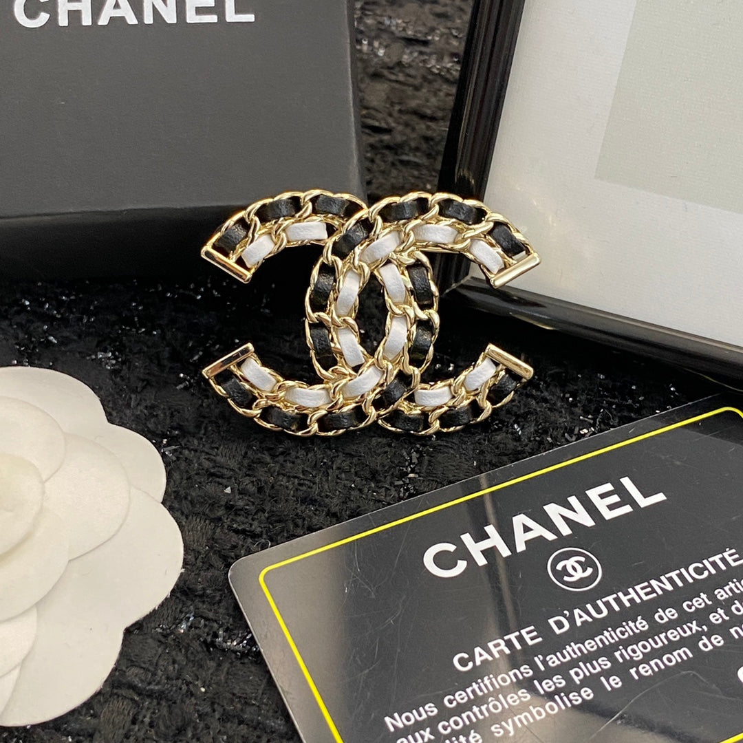 Signature Emblem Brooch in Polished Metal-Tone – Black Detail main product view