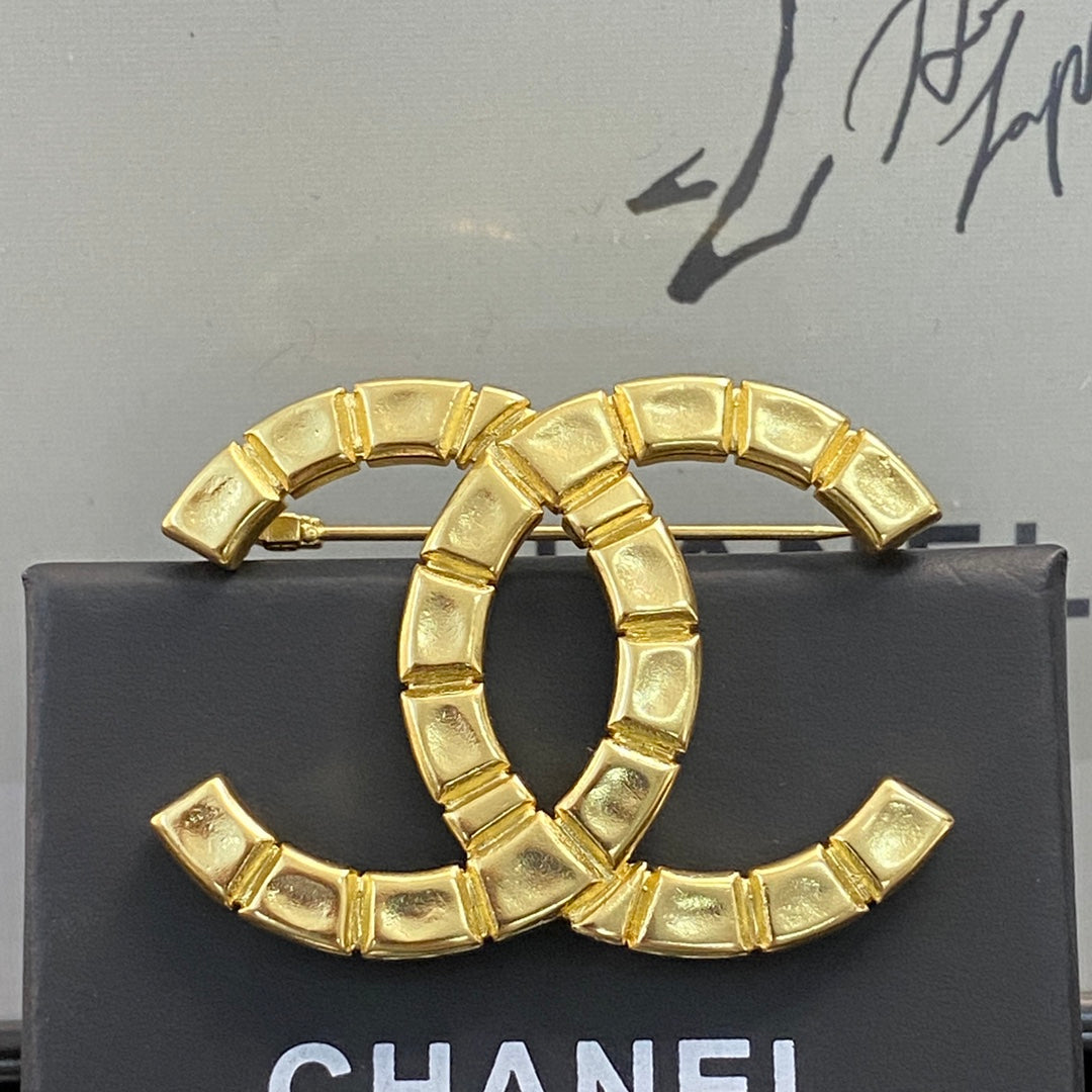 Double-C Emblem Brooch in Polished Metal-Tone – Design 006 detail view