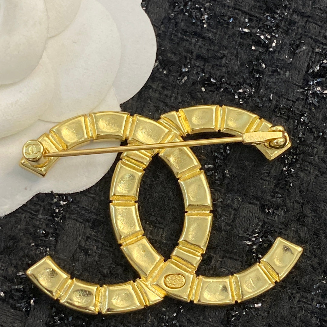 Double-C Emblem Brooch in Polished Metal-Tone – Design 006 styled product view