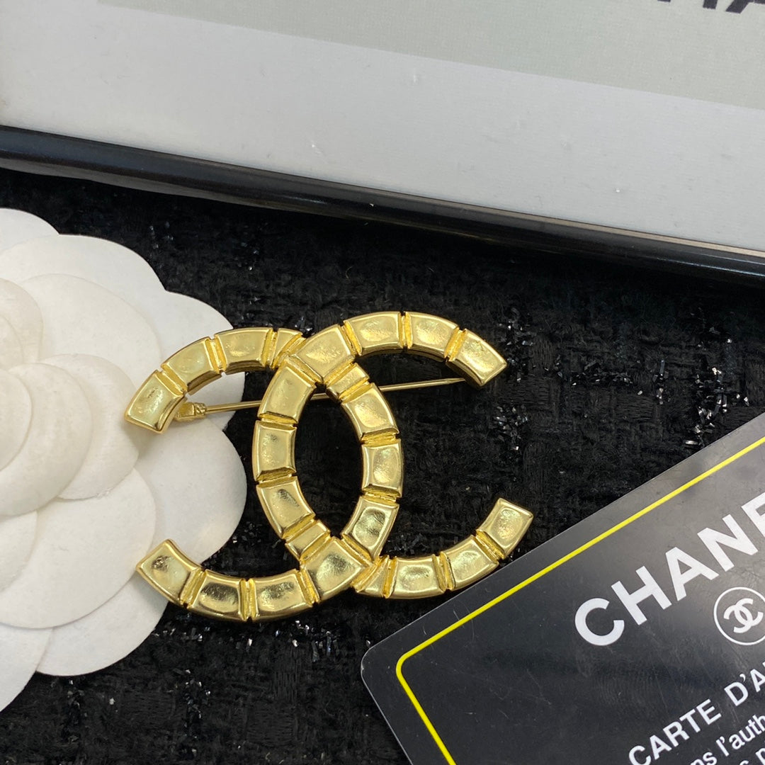 Double-C Emblem Brooch in Polished Metal-Tone – Design 006 detail view