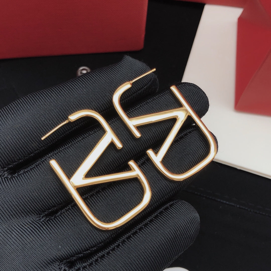 Signature Emblem Polished Stud Earrings – Medium front view