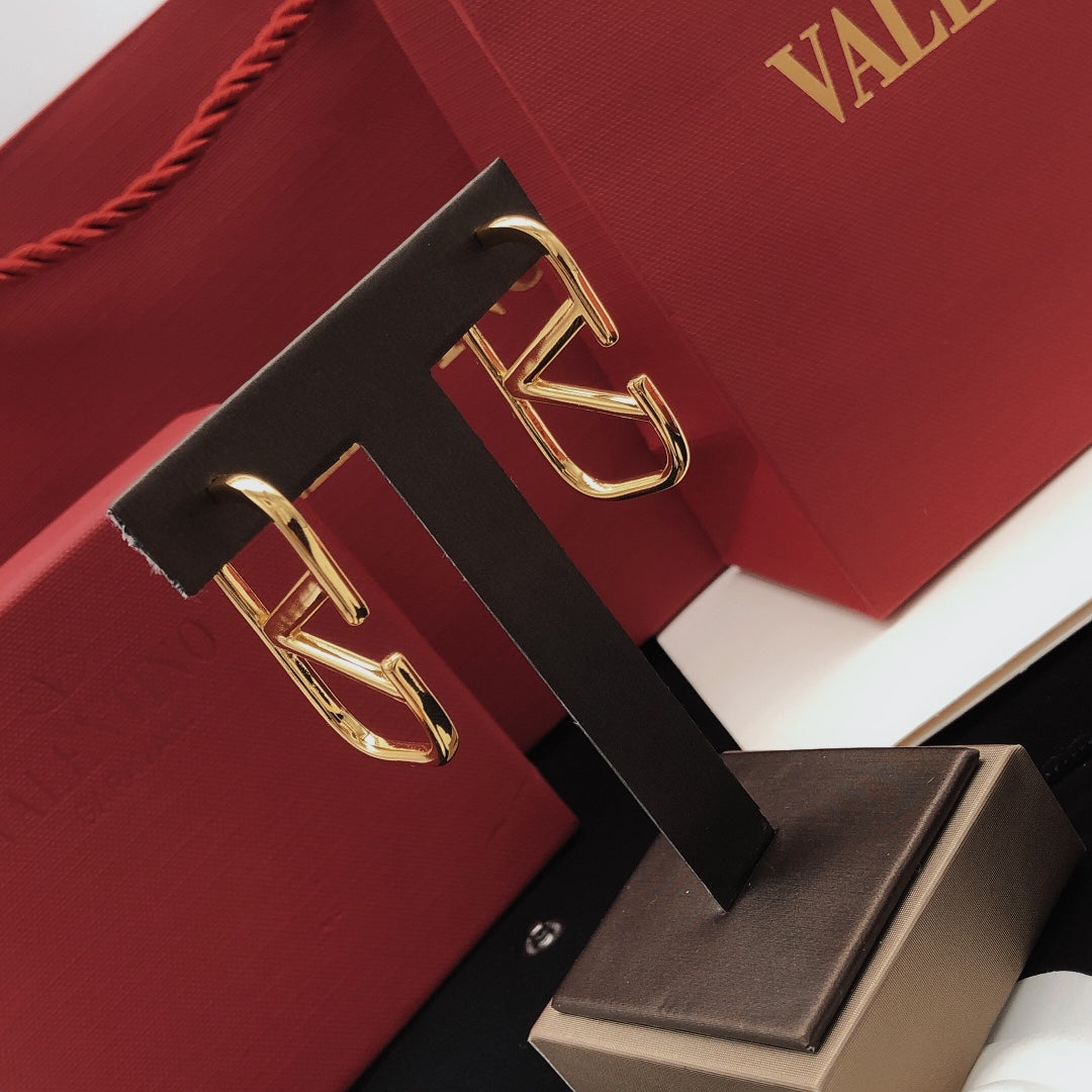 Signature Emblem Polished Stud Earrings – Medium close-up view
