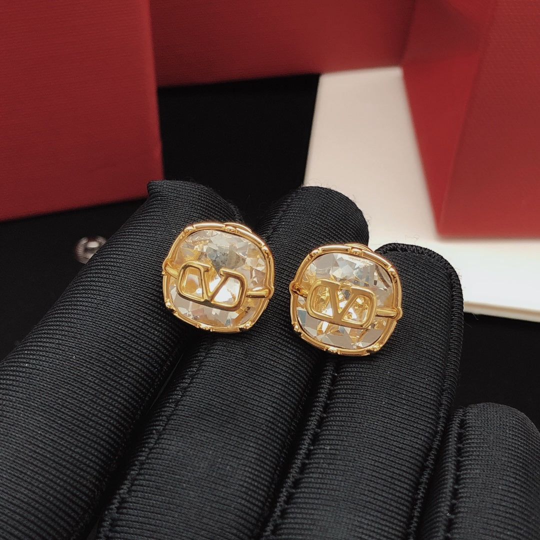 Signature Emblem Crystal-Accent Stud Earrings – White styled detail