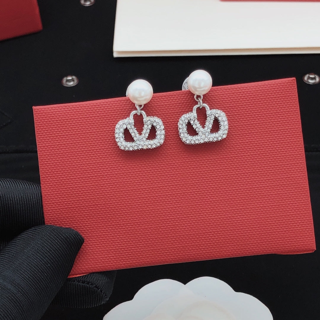 Signature Emblem Pearl-Detail Stud Earrings – Design 05 close-up view