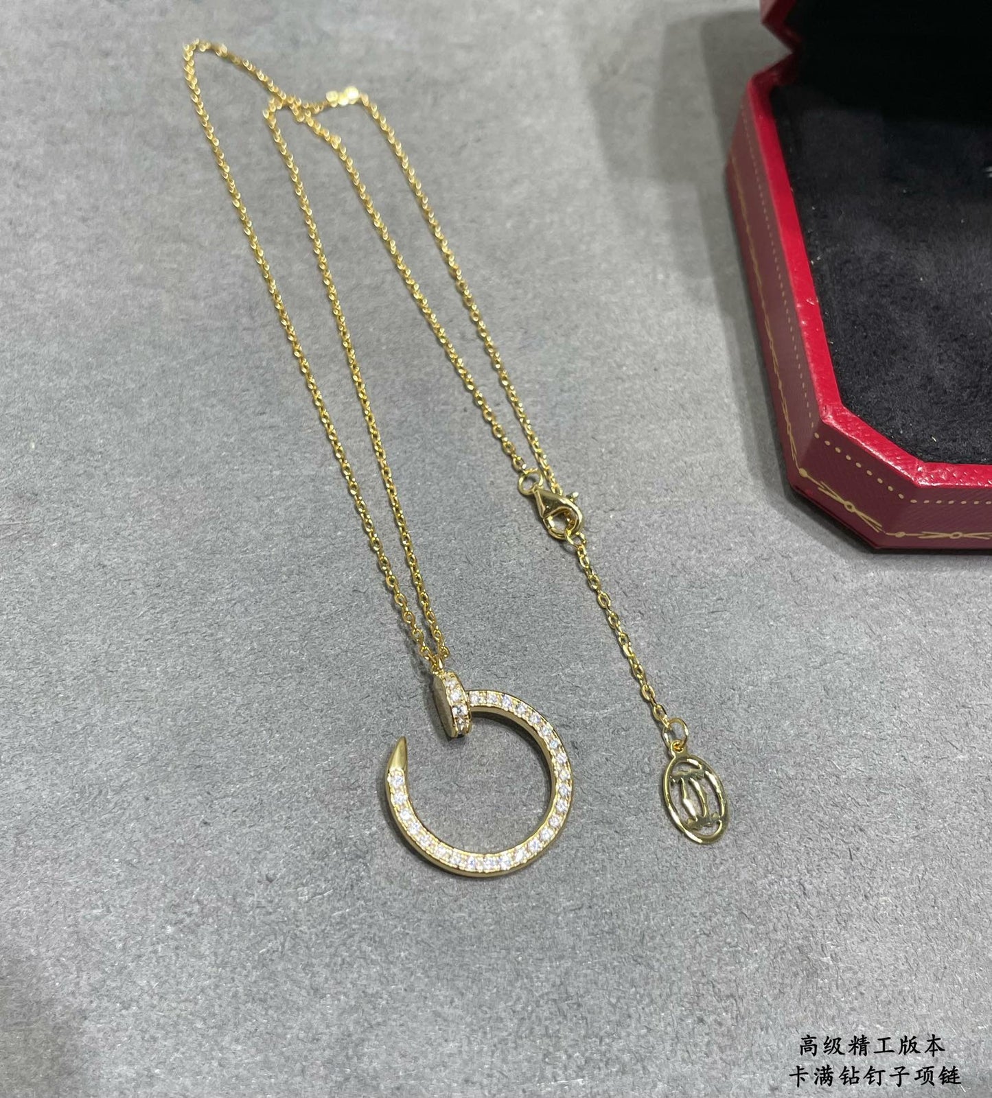Nail Motif Pendant Necklace in Rose-Gold-Tone with Crystal-Style Accents close-up detail