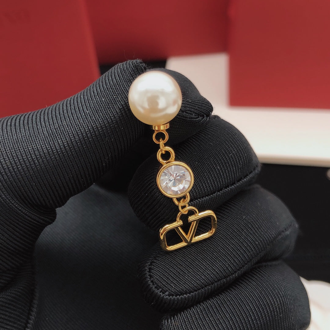 Signature Emblem Stud Earrings in Gold-Tone – Design 19 close-up view