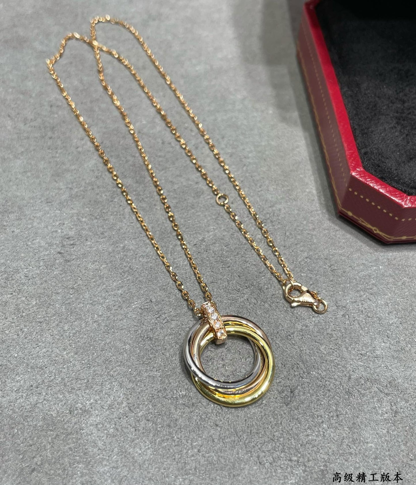 Triple-Ring Motif Pendant Necklace in Gold-Tone close-up detail