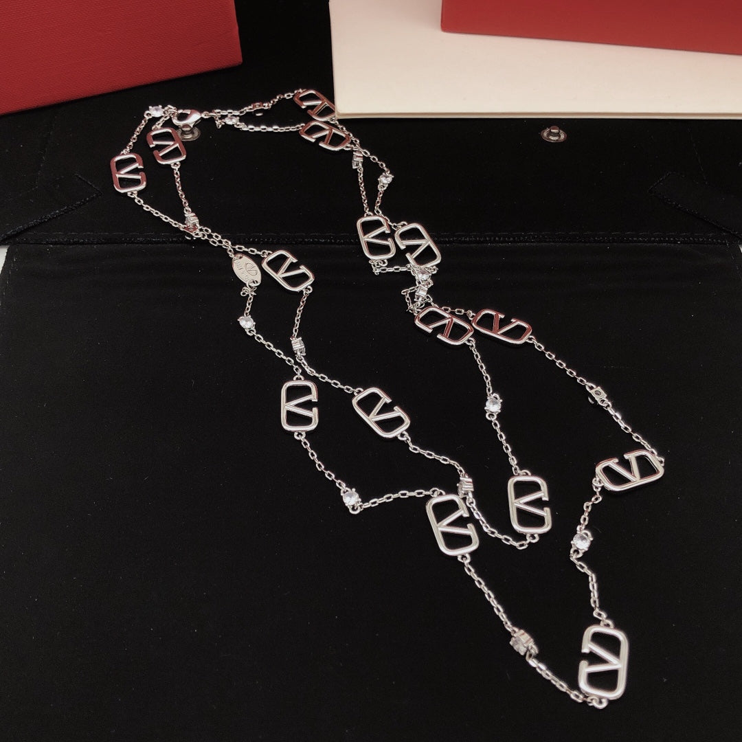 Signature Emblem Double-Layer Pendant Necklace close-up view