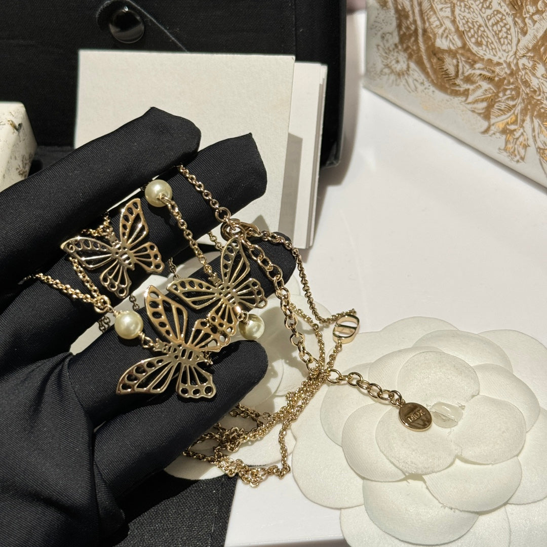 Bow & Butterfly Motif Pendant Necklace in Gold-Tone with Layered Detail – Design 001 styled view
