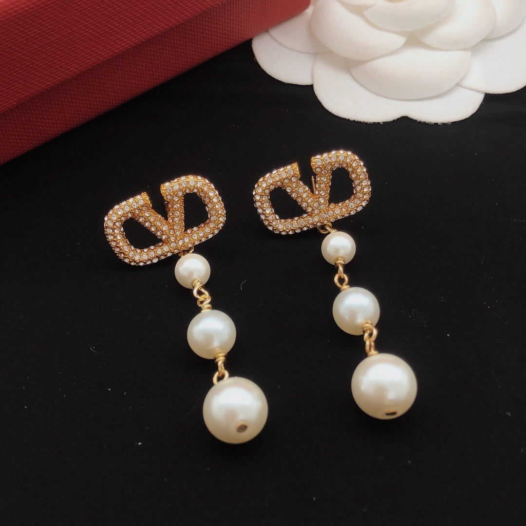 Signature Emblem Stud Earrings in Gold-Tone – Design 13 close-up view