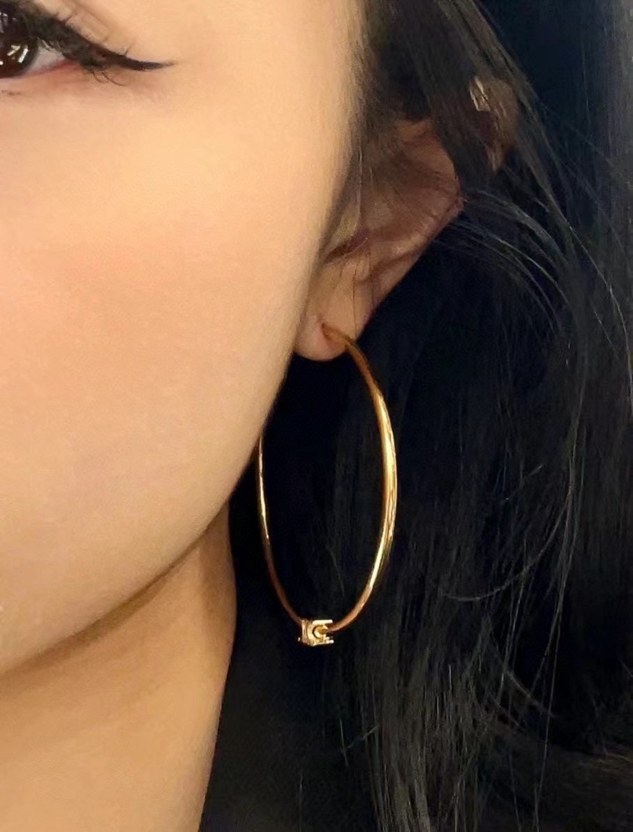 Oversized Triomphe-Inspired Emblem Statement Earrings front view