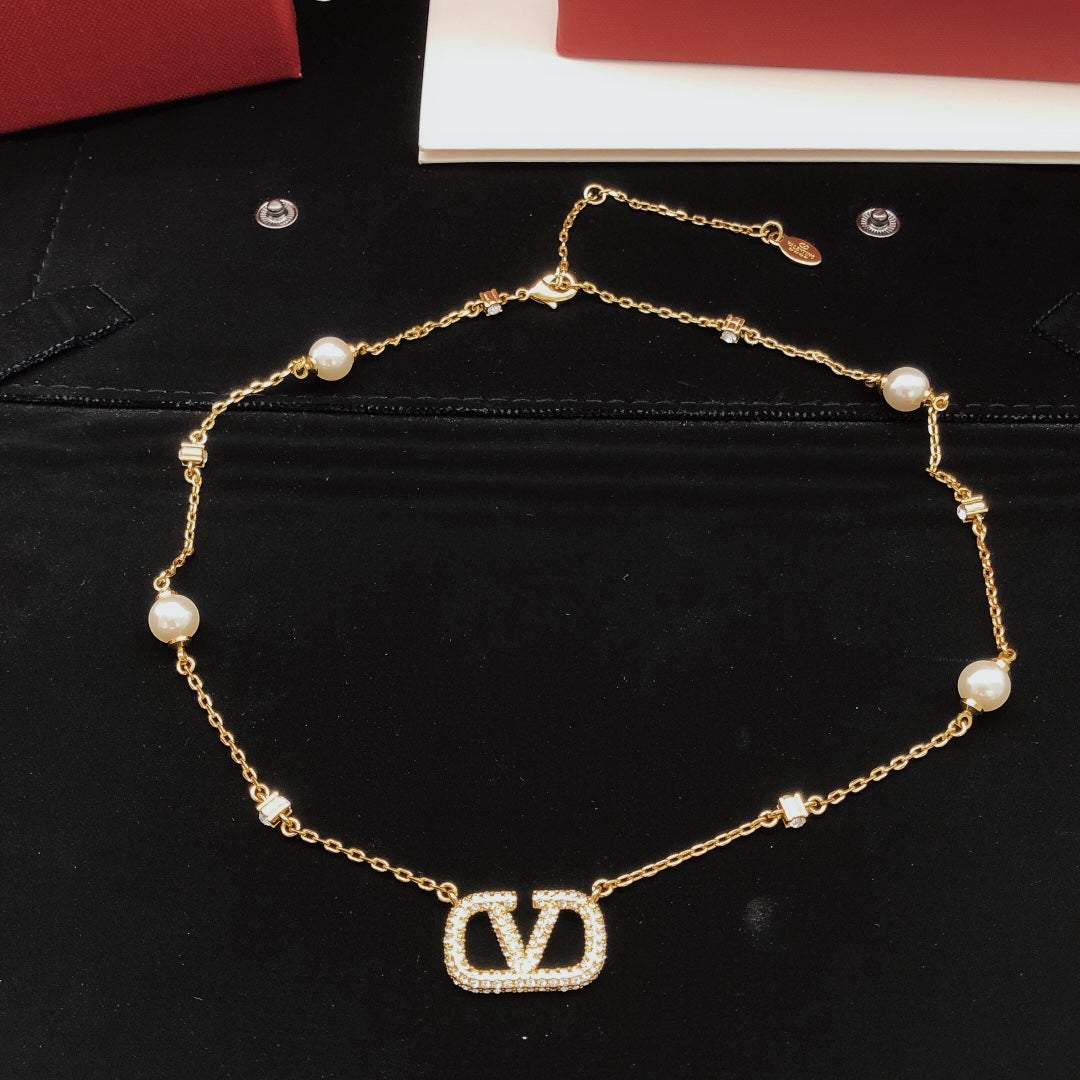 Signature Emblem Pendant Necklace in Gold-Tone – Design 02 close-up view