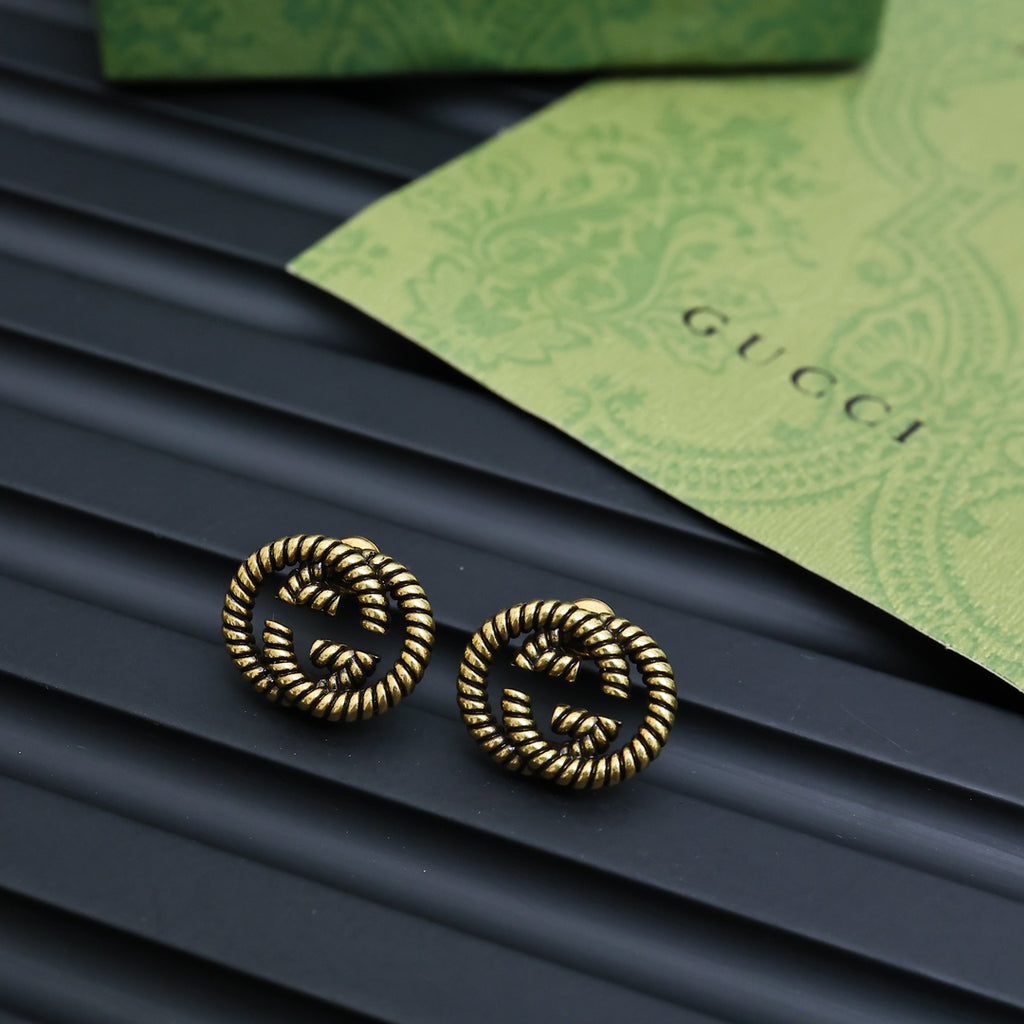 Serpentine Stud Earrings in Polished Metal-Tone front product view