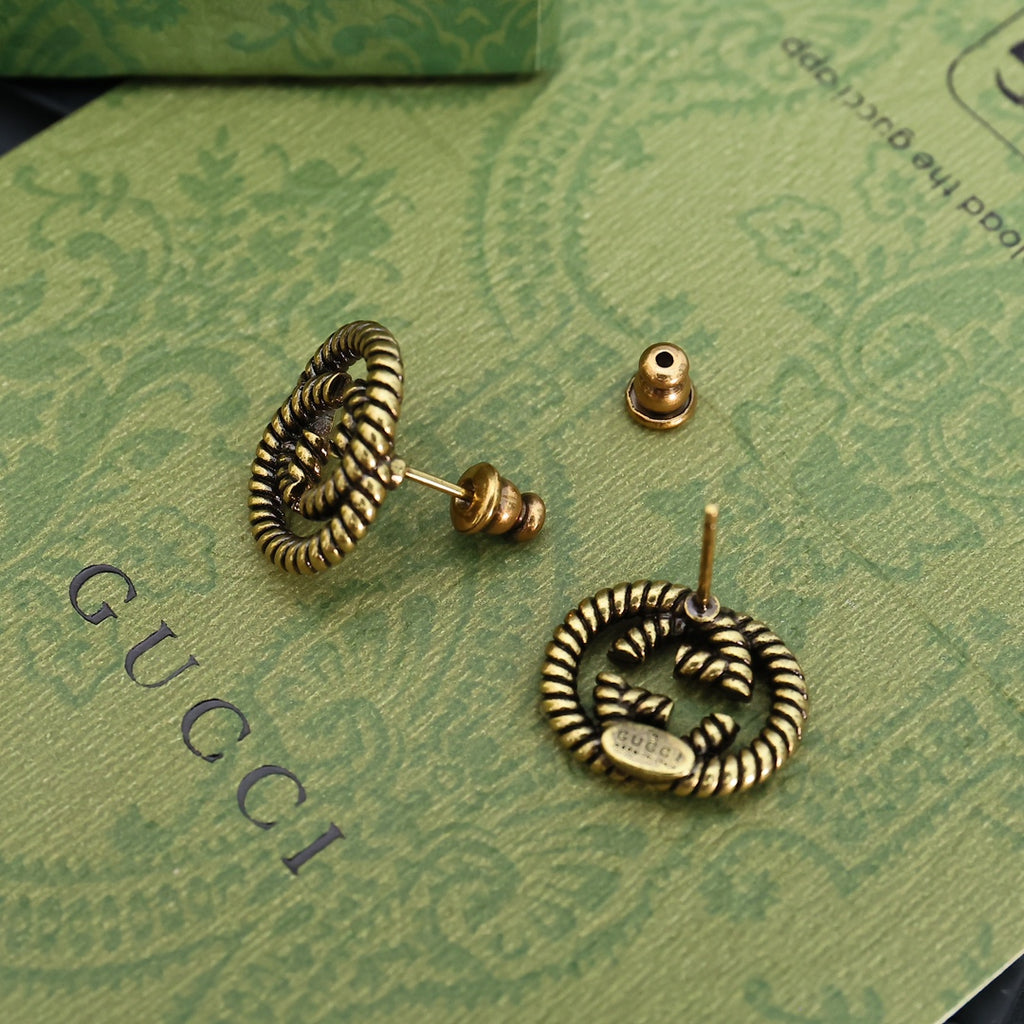Serpentine Stud Earrings in Polished Metal-Tone close-up detail