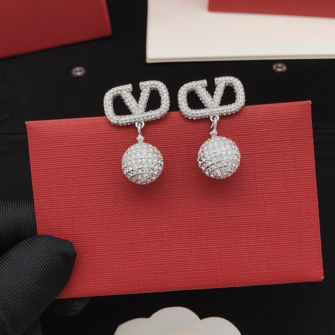 Signature Emblem Crystal-Accent Stud Earrings – Design 01 detail view
