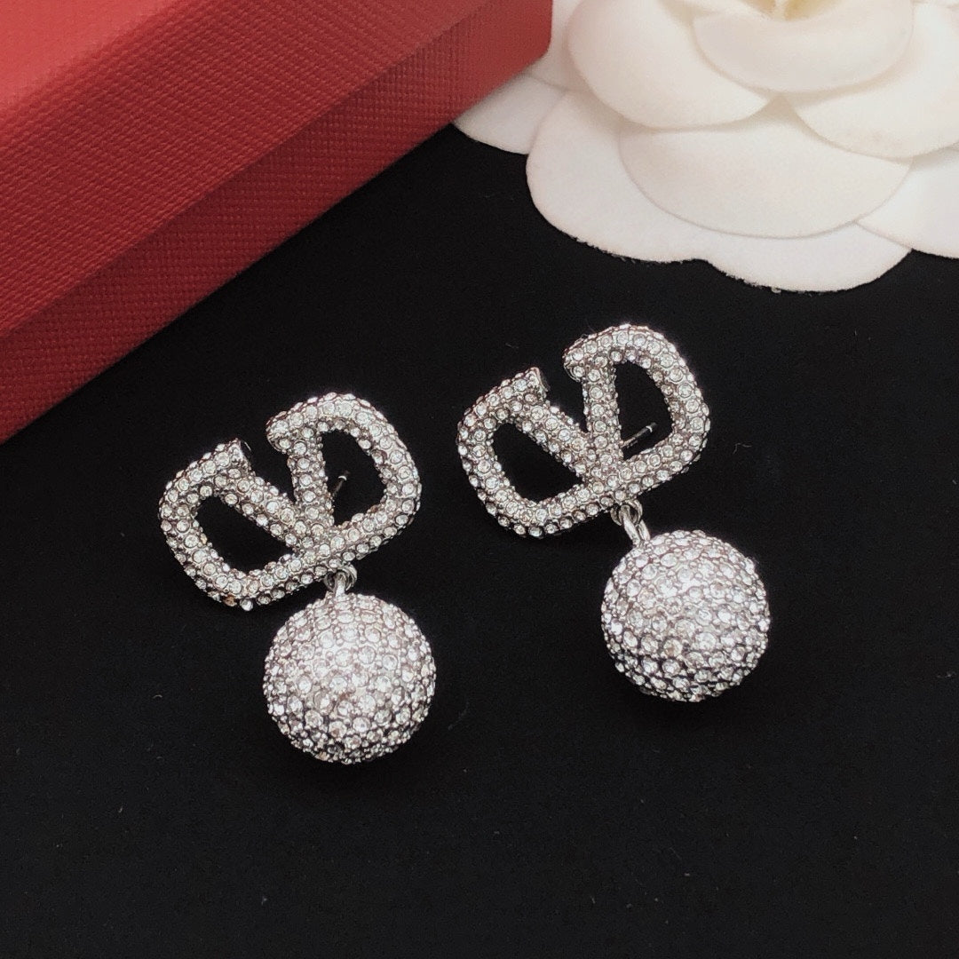 Signature Emblem Crystal-Accent Stud Earrings – Design 01 close-up view