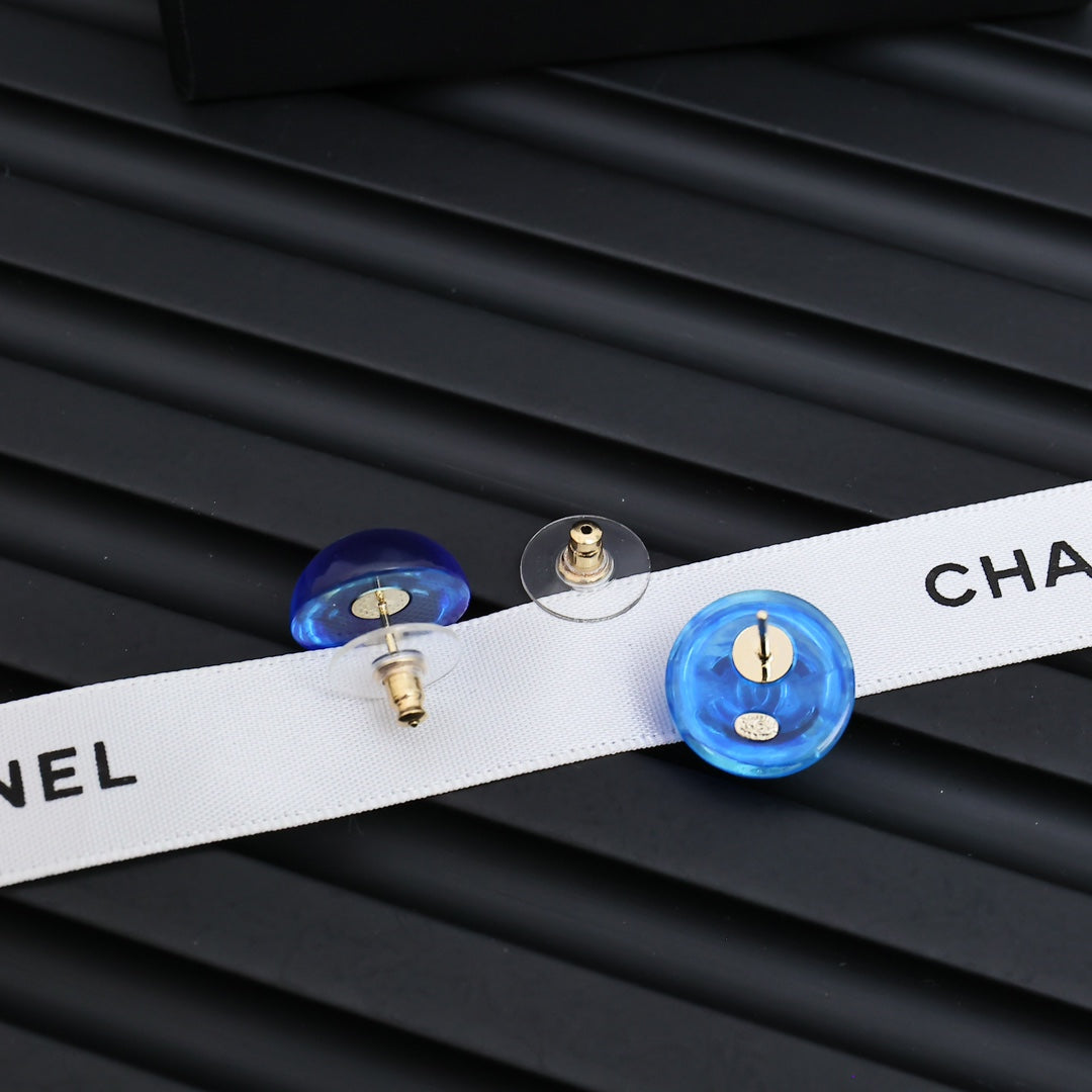 Signature Emblem Stud Earrings in Polished Metal-Tone – Blue Detail close-up detail
