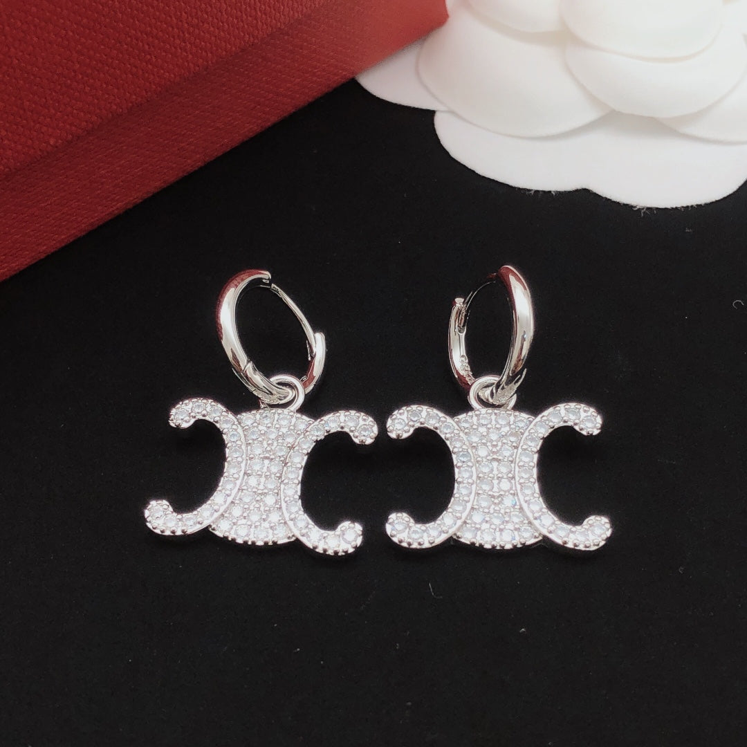 Signature Emblem Crystal-Accent Drop Earrings styled detail