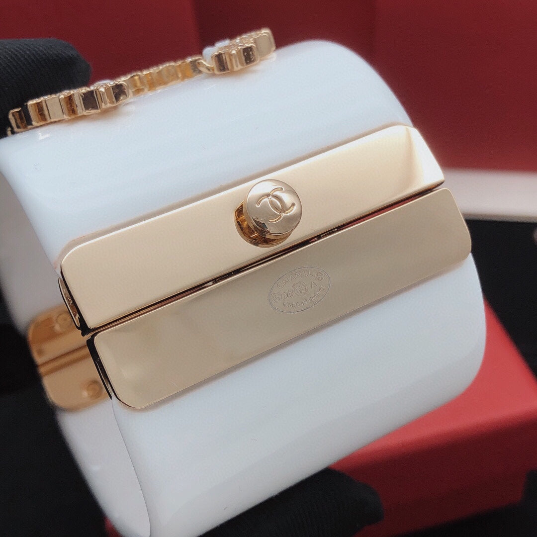 Signature Emblem Bangle in Gold-Tone – White Detail – Design 003 close-up detail