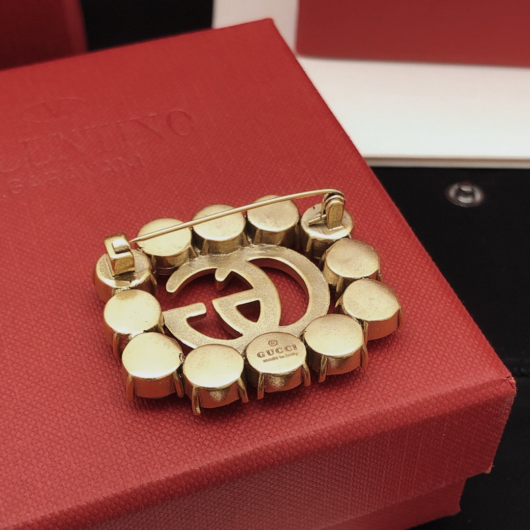 Geometric Emblem Brooch in Gold-Tone close-up detail