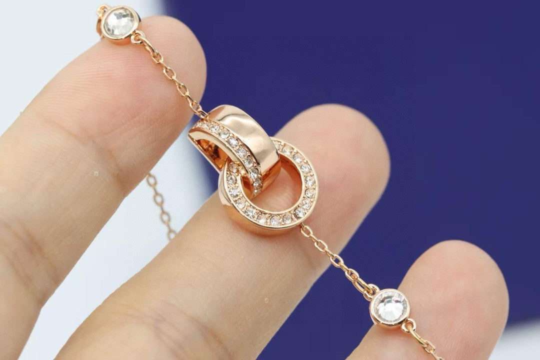 Interlocking Ring Adjustable Bracelet in Rose-Gold-Tone close-up detail