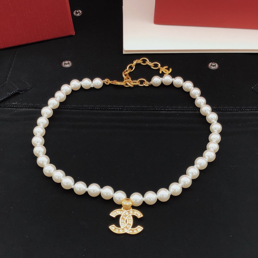Double-C Emblem Pearl-Detail Pendant Necklace – Pearl Detail – Design 110 detail view