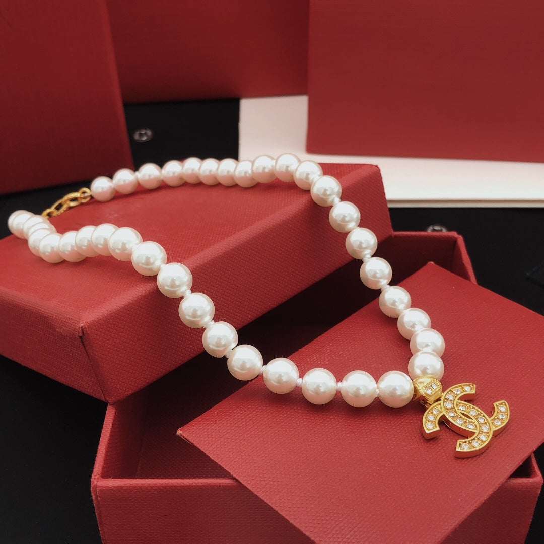 Double-C Emblem Pearl-Detail Pendant Necklace – Pearl Detail – Design 110 side detail