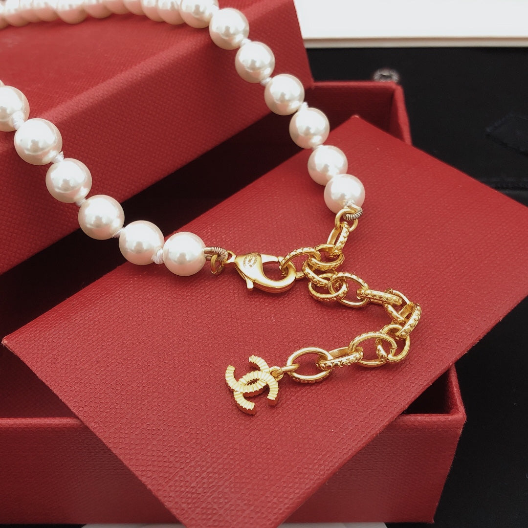 Double-C Emblem Pearl-Detail Pendant Necklace – Pearl Detail – Design 110 styled product view