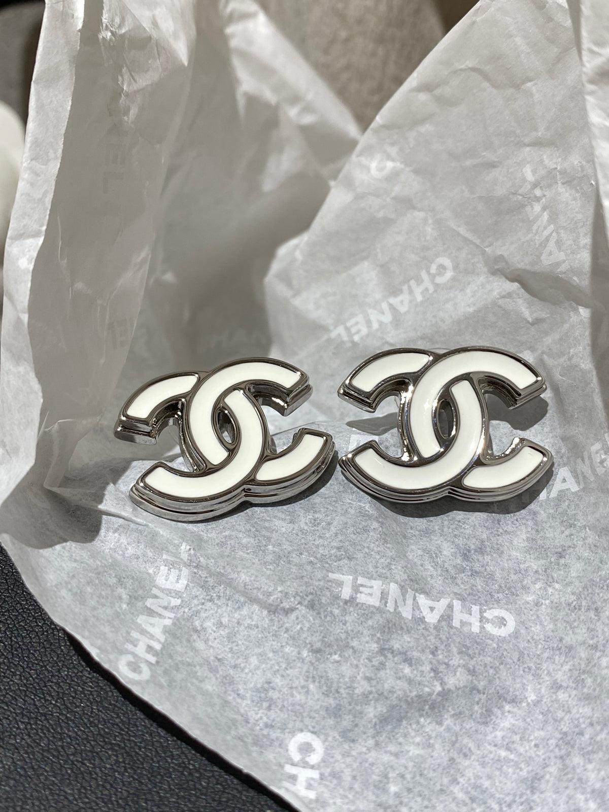 Double-C Emblem Stud Earrings in Polished Metal-Tone – White Detail – Design 004 main product view