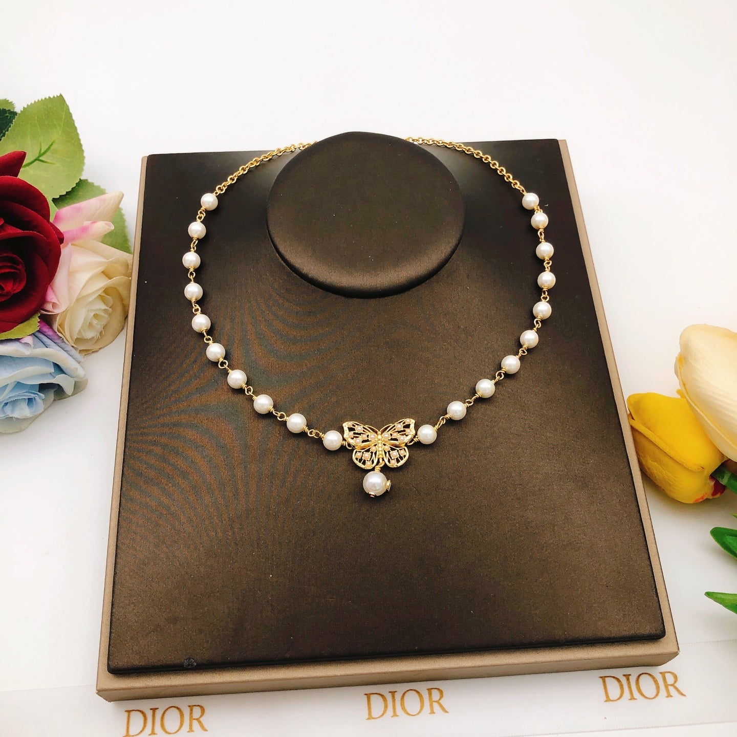 Bow & Butterfly Motif Pendant Necklace in Polished Metal-Tone with Pearl-Style Detail – Design 001 main product view