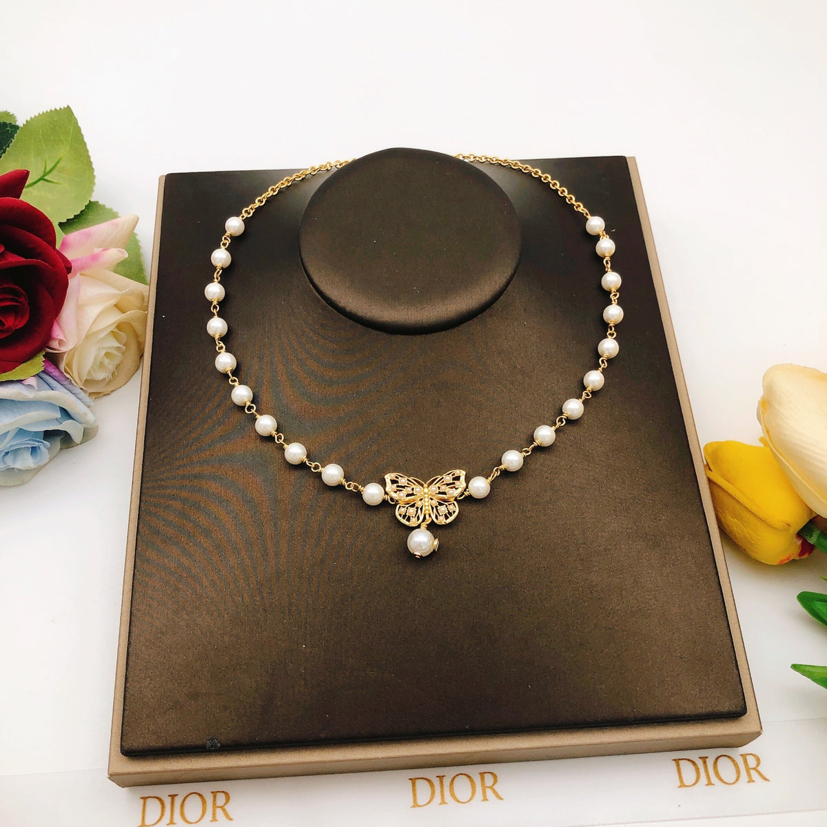 Bow & Butterfly Motif Pendant Necklace in Polished Metal-Tone with Pearl-Style Detail – Design 001 main product view