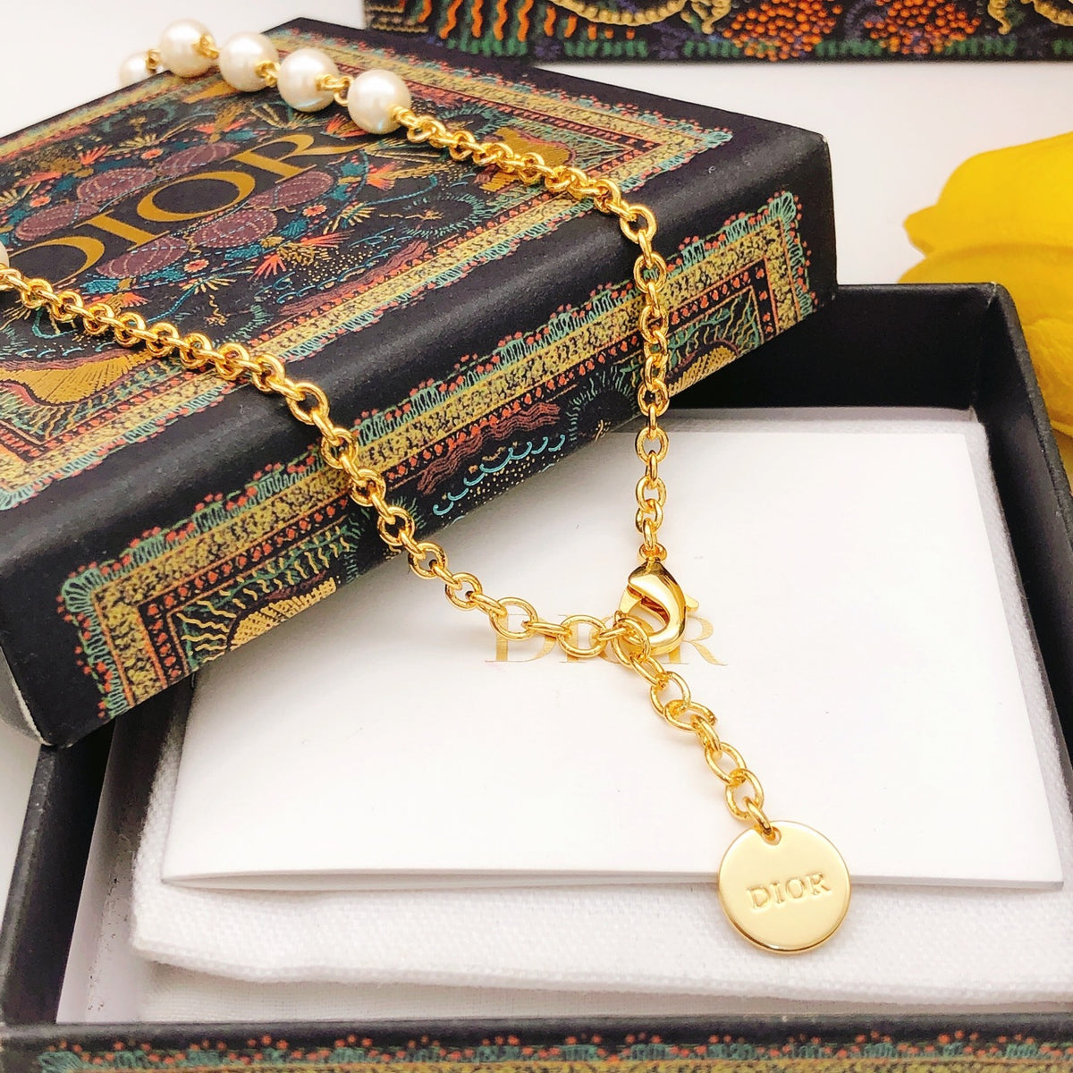 Bow & Butterfly Motif Pendant Necklace in Polished Metal-Tone with Pearl-Style Detail – Design 001 main product view