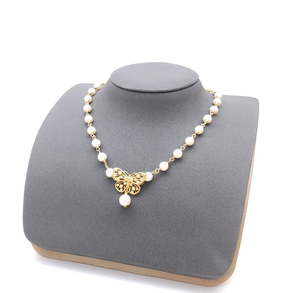 Bow & Butterfly Motif Pendant Necklace in Polished Metal-Tone with Pearl-Style Detail – Design 001 front view