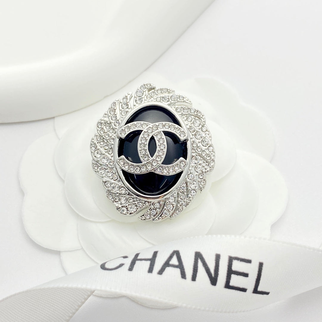 Signature Emblem Brooch in Black-Tone front product view