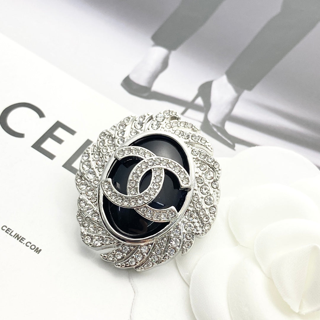 Signature Emblem Brooch in Black-Tone front product view