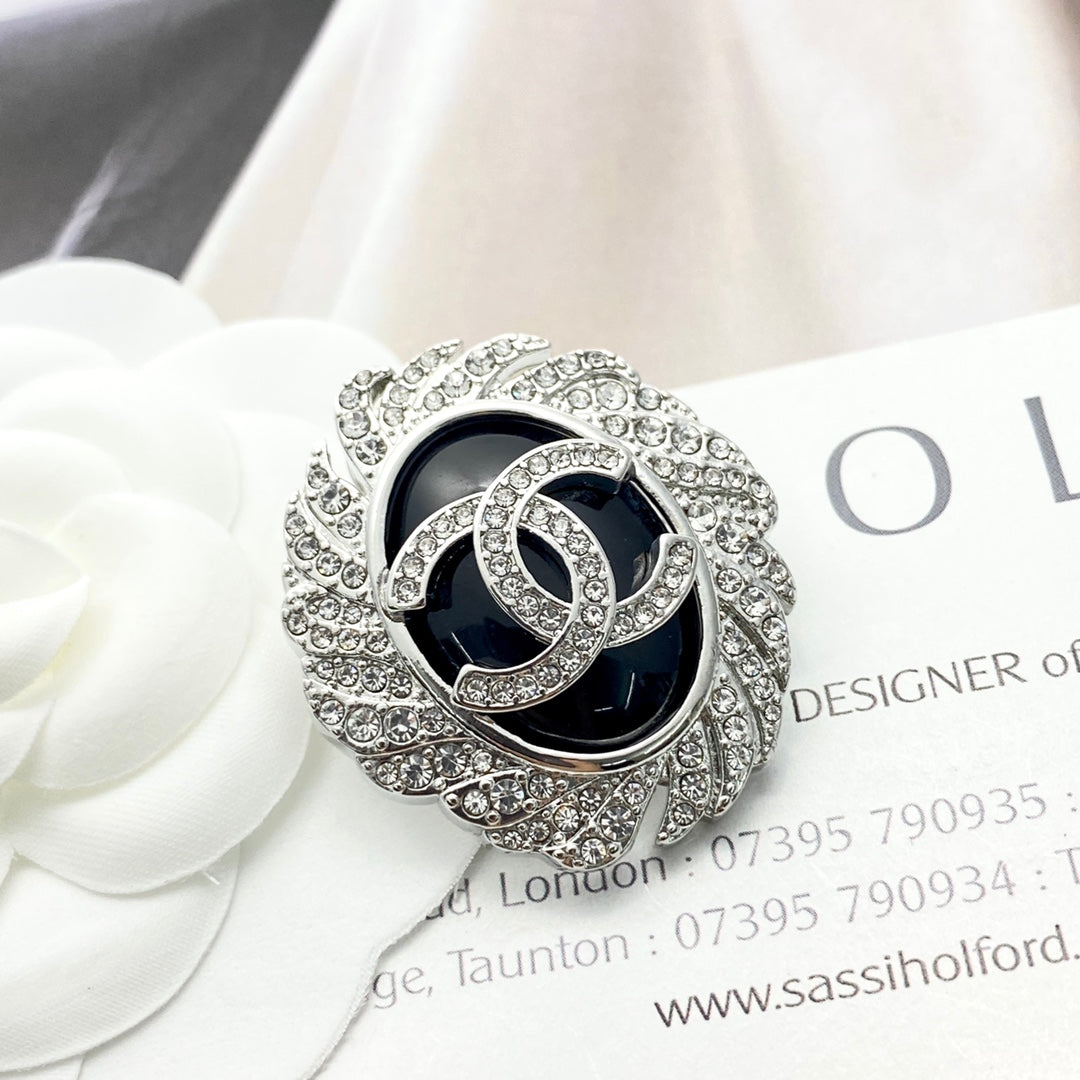 Signature Emblem Brooch in Black-Tone detail view