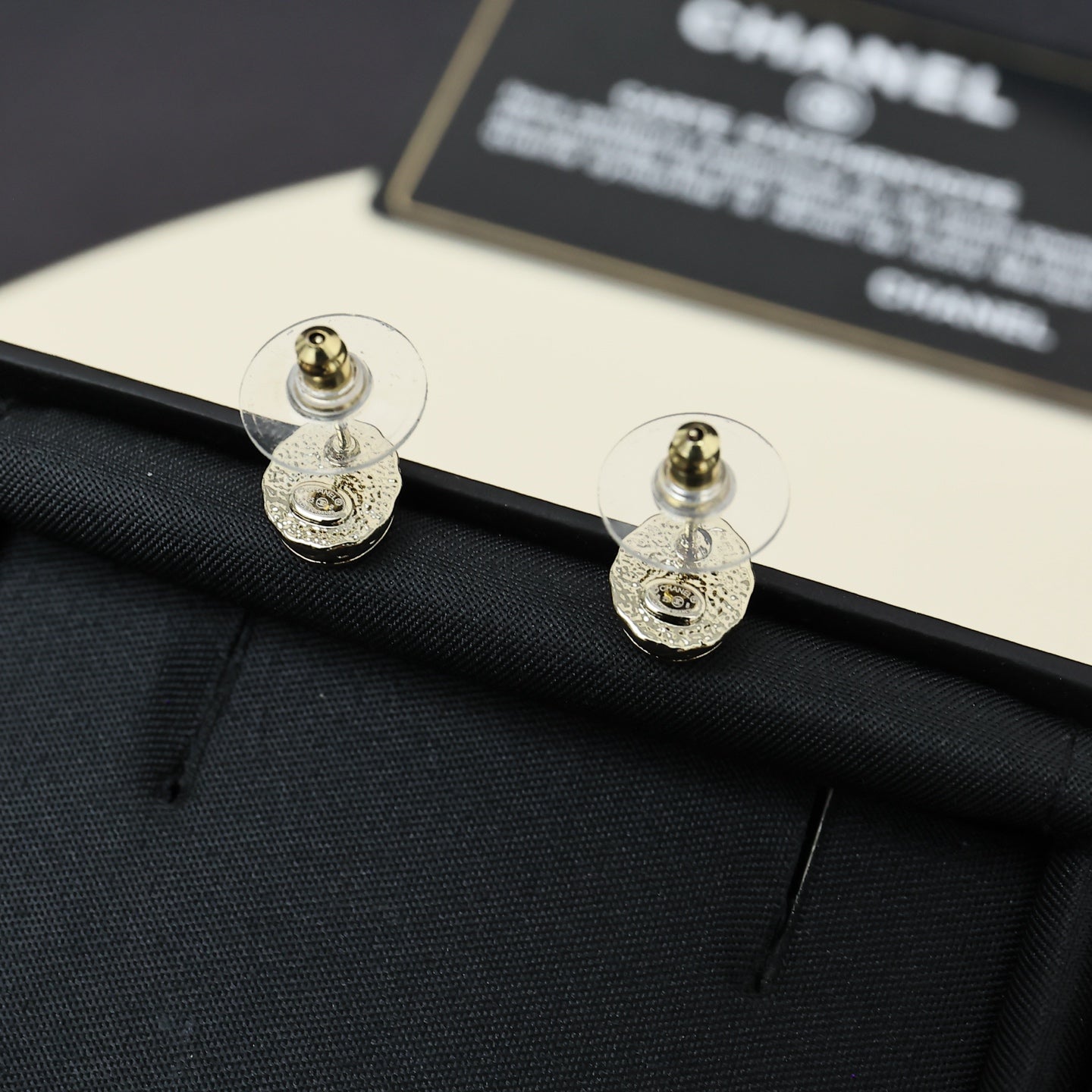 Signature Emblem Stud Earrings in Polished Metal-Tone – Pink Detail detail view